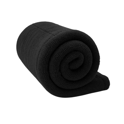 Rolled-up black towel on a white background